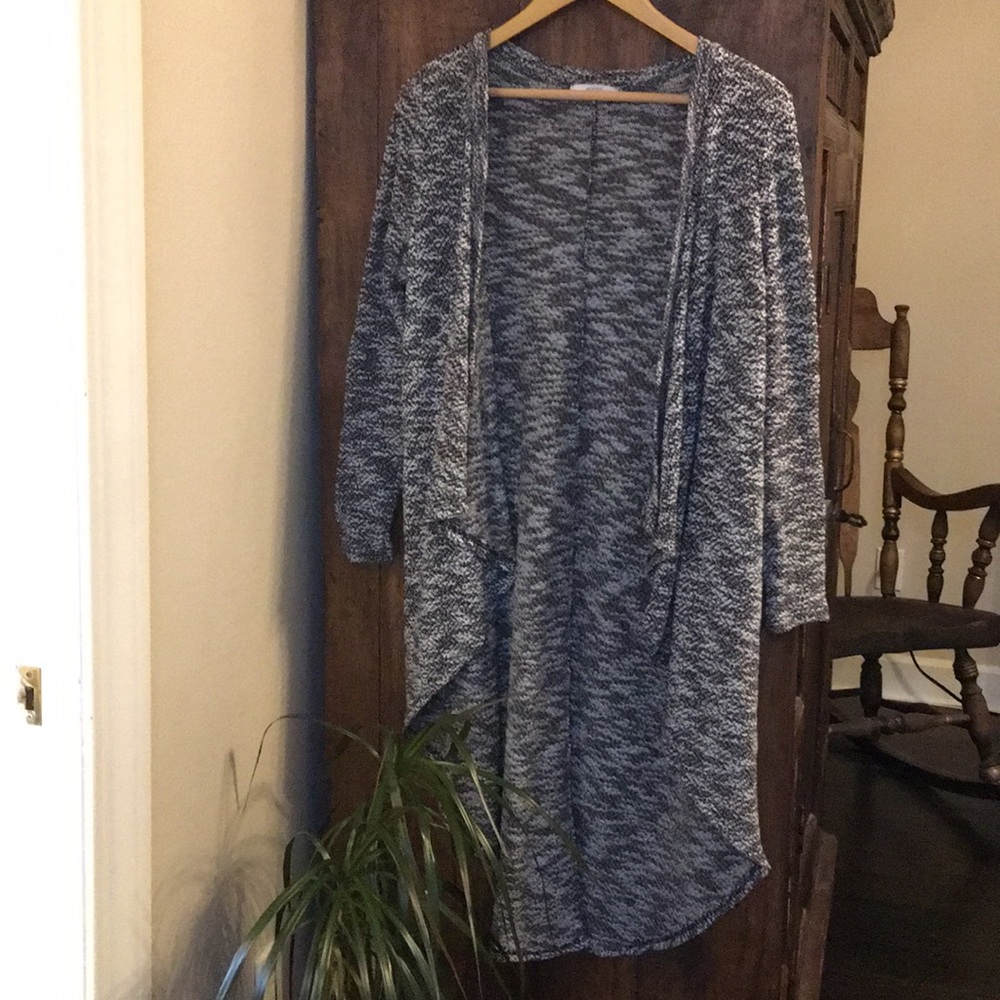 Long sweater.  High in front and low in the back.